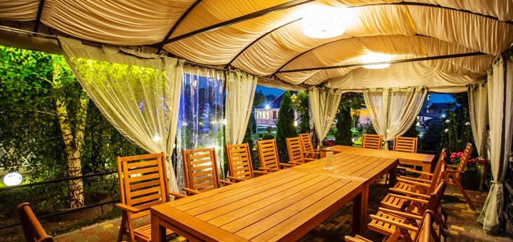Summer terrace at the Sofiyivsky Posad restaurant in Kiev. Order cheap